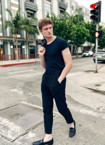 Brennan in a black dress